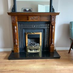 Wooden fireplace includes hearth
