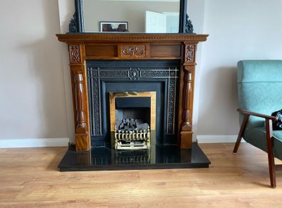 Wooden fireplace includes hearth