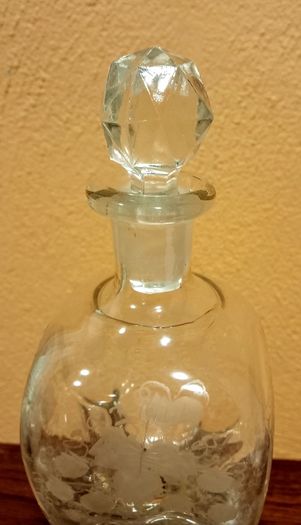 Antique hourglass shaped glass decanter