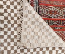 Handwoven beige checkerboard rug