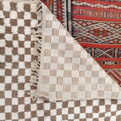 Handwoven beige checkerboard rug