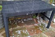 Black hard plastic garden or pargola table