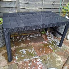 Black hard plastic garden or pargola table