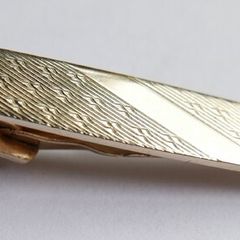 Gold plated tie clip with textured detail