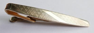 Gold plated tie clip with textured detail