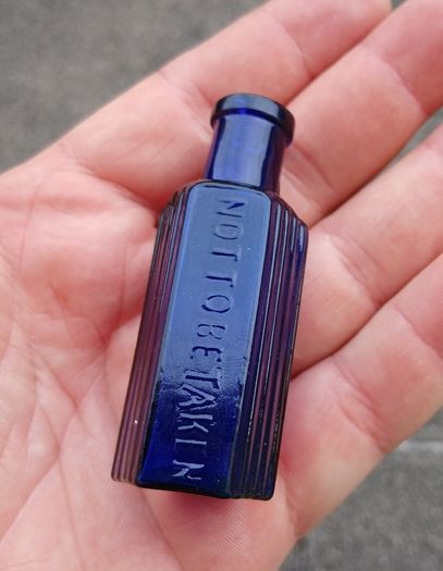 Rare Not To Be Taken 1/2oz blue glass bottle