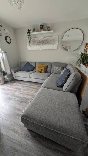 Gray fabric corner chase sofa with footstool
