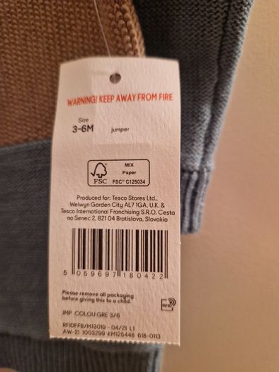 A selection of brand new baby clothes and items