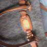 Michael Kors brown signature large handbag with shoulder strap. Spacious interior with multiple pockets. In perfect condition apart from one small tear, as shown in the photo. Image 8