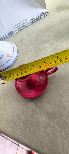 3 different itmes- 1- pottery modern design handmade candle holder 18.00 euro. 2-  red enamel candlestick holder and drip tray featuring a Considered by Helen James 12.00 euro. 3-  PAPERWEIGHT 15.00 euro