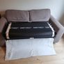 Grey two-seater sofa bed with matching storage footstool Image 5