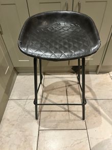Three  black quilted kitchen bar stools