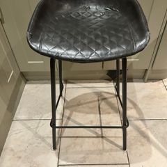 Three  black quilted kitchen bar stools