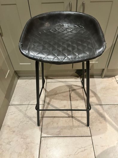 Three  black quilted kitchen bar stools