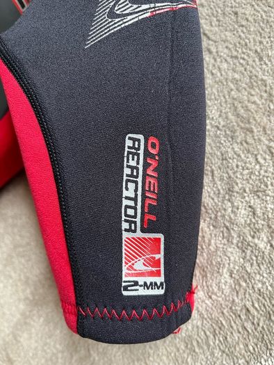 O'Neill child's 2mm shorty wetsuit and buoyancy aid.