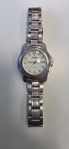 Silver-toned Reflex Quartz wristwatch with a white wave-patterned dial