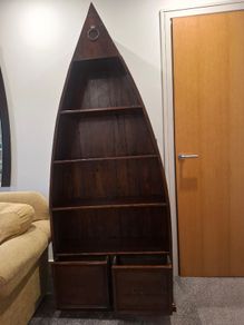 Wooden boat-shaped bookcase with two drawers
