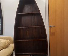 Wooden boat-shaped bookcase with two drawers