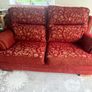 Red and gold 2 seater reversible print sofa Image 3
