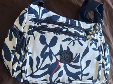 Brand New This is a Kipling Gabbie crossbody shoulder bag in the "Crazy Leaves" / Navy & Cream Leaf print colorway.