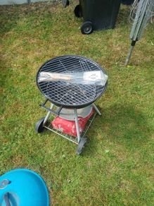 charcoal BBQ, with a bag of charcoal