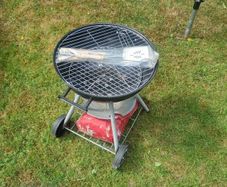 charcoal BBQ, with a bag of charcoal