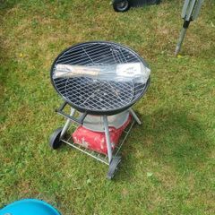 charcoal BBQ, with a bag of charcoal