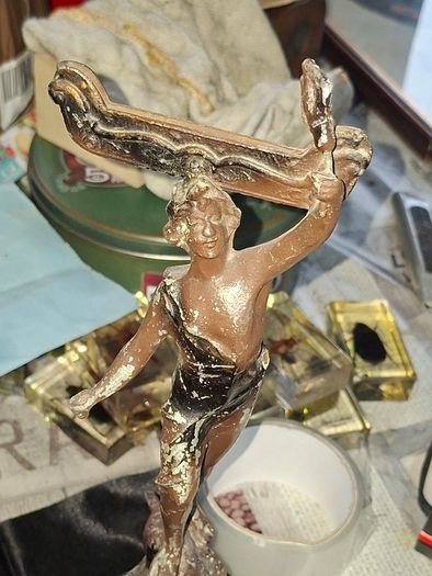 A Pair of Antique French Spelter Statues titled La Force (The Strength) and Le Pouvoir (The Power). The feature a male and female figure standing a top lions, raising up flaming torches