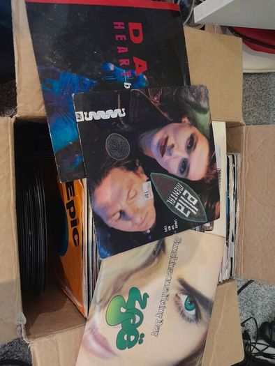 a box of 7" singles. 45 rpm vinyl records.