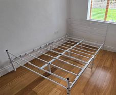 Double bed metal frame white.