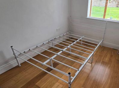 Double bed metal frame white.