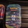 Three Pokemon tins with two coins. Image 4