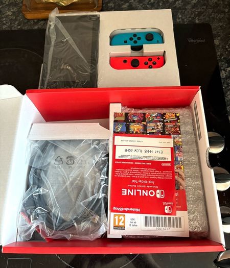 Nintendo Switch Neon Red/Blue with Improved Battery Life- Barely used