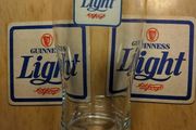 Guinness Light pint glass and beer mats