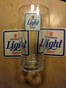 Guinness Light pint glass and beer mats