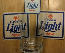 Guinness Light pint glass and beer mats
