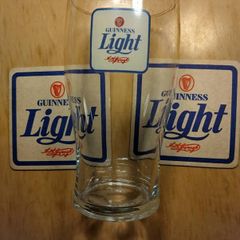 Guinness Light pint glass and beer mats