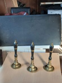 Antique brass beer pumps.