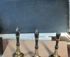 Antique brass beer pumps.