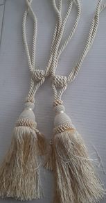 Pair cream curtain ties