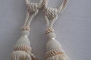 Pair cream curtain ties