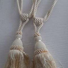 Pair cream curtain ties