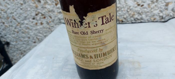 vintage bottle of winters tale sherry 3/4 full ,found in a old pub closed down,