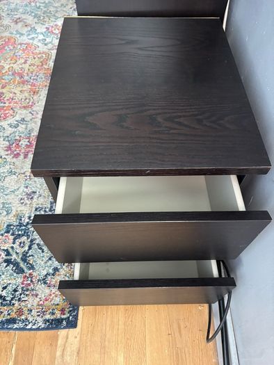 drawers in a black-brown wood veneer finish glass top