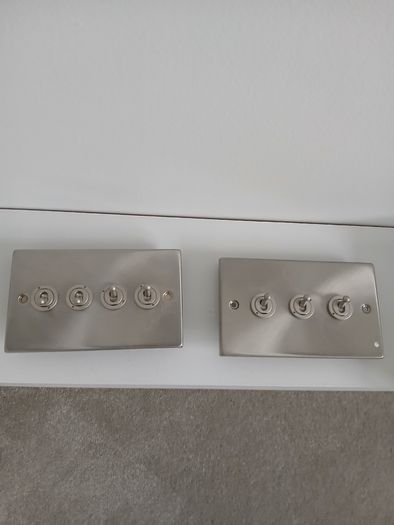 Brushed steel toggle light switches - 3 and 4 gang