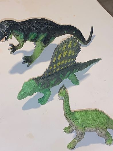 Three dinosaur toys