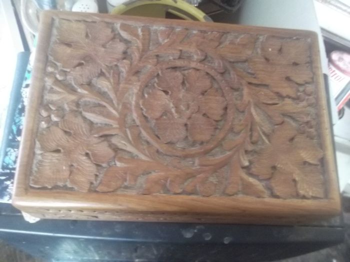 a antique carved wooden box