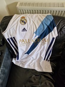 2 men's Arsenal t-shirts 1Real Madrid