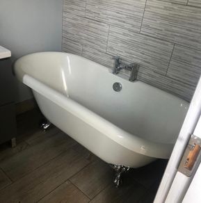 Bath with chrome legs and waterfall chrome taps
