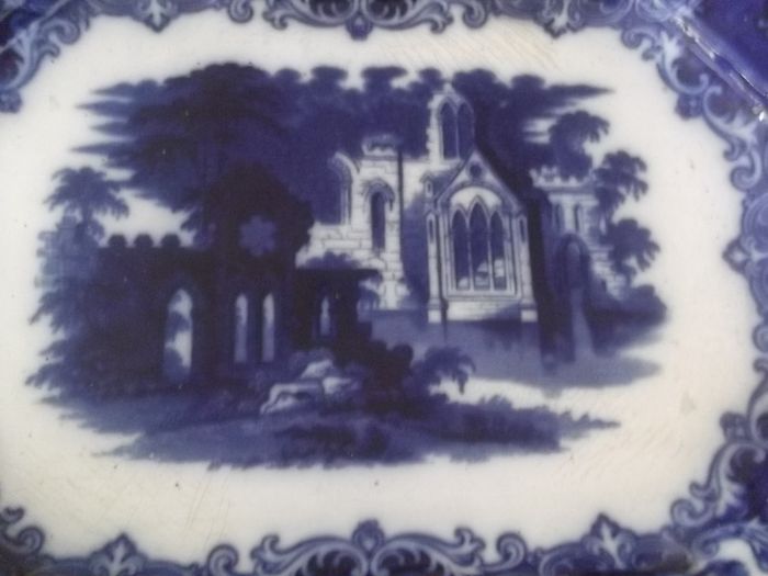 a large antique meat platter called flow blue date 1850
